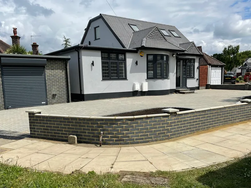 Completed four-bedroom bungalow in Harrow with a new frontage, low brick wall and paved driveway